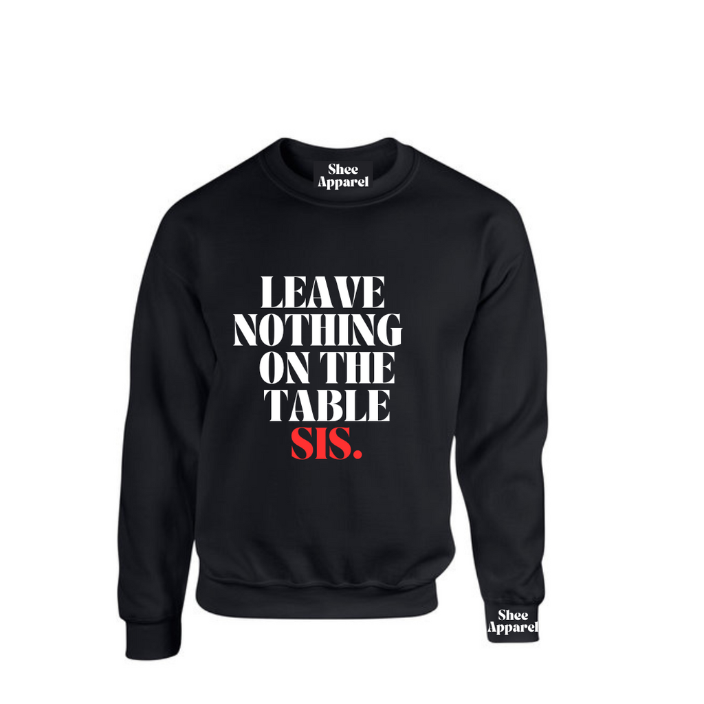Model wearing the SheeApparel® Leave Nothing on the Table, Sis™ black crewneck sweatshirt featuring bold white and red affirmation text