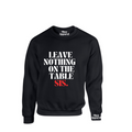 Model wearing the SheeApparel® Leave Nothing on the Table, Sis™ black crewneck sweatshirt featuring bold white and red affirmation text